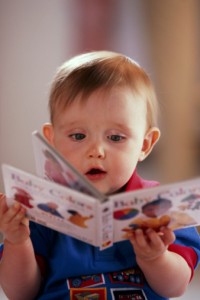 78401062-baby-playing-with-book-jupiterimages