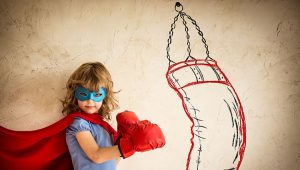 http://www.dreamstime.com/royalty-free-stock-images-winner-superhero-kid-red-boxing-gloves-punching-drawn-bag-success-concept-image45466089