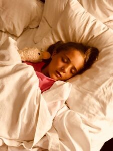Child Sleeping With Stuffed Animal 