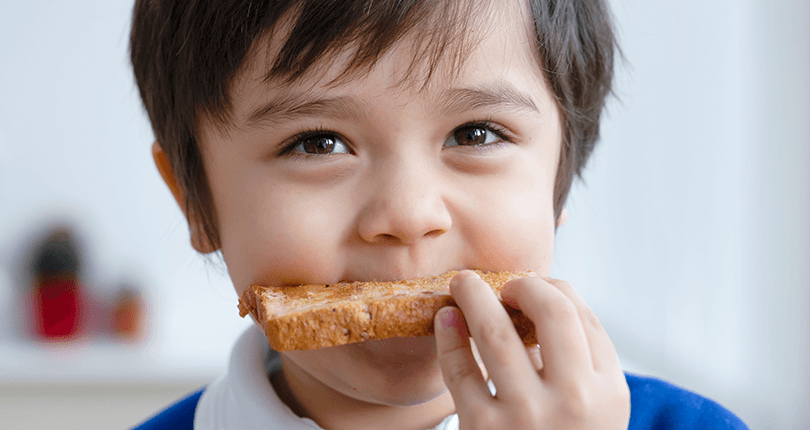 Child eating toast