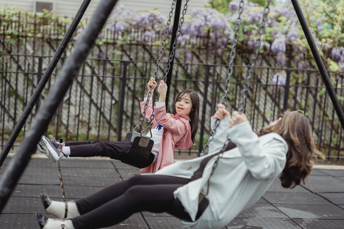 kids on swings playing outdoors