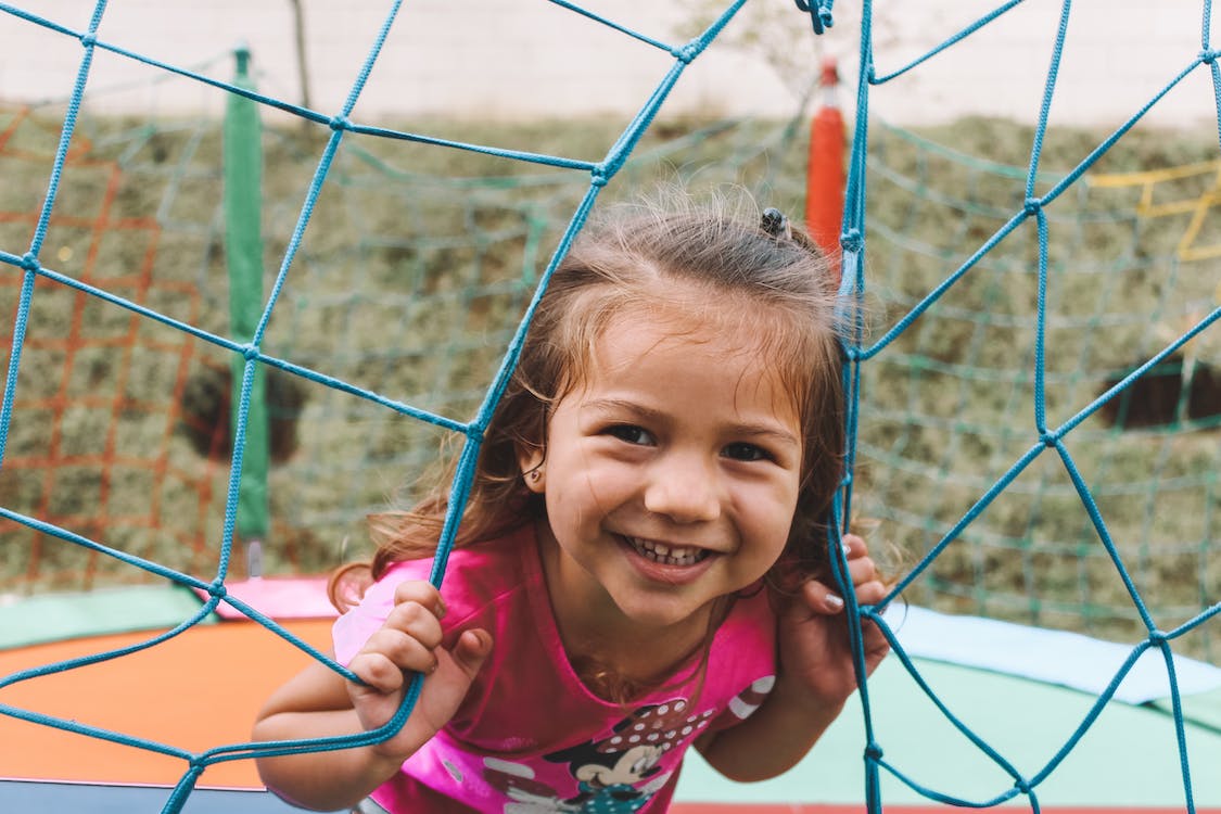 girl happy outdoors playing