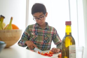 child prepping food