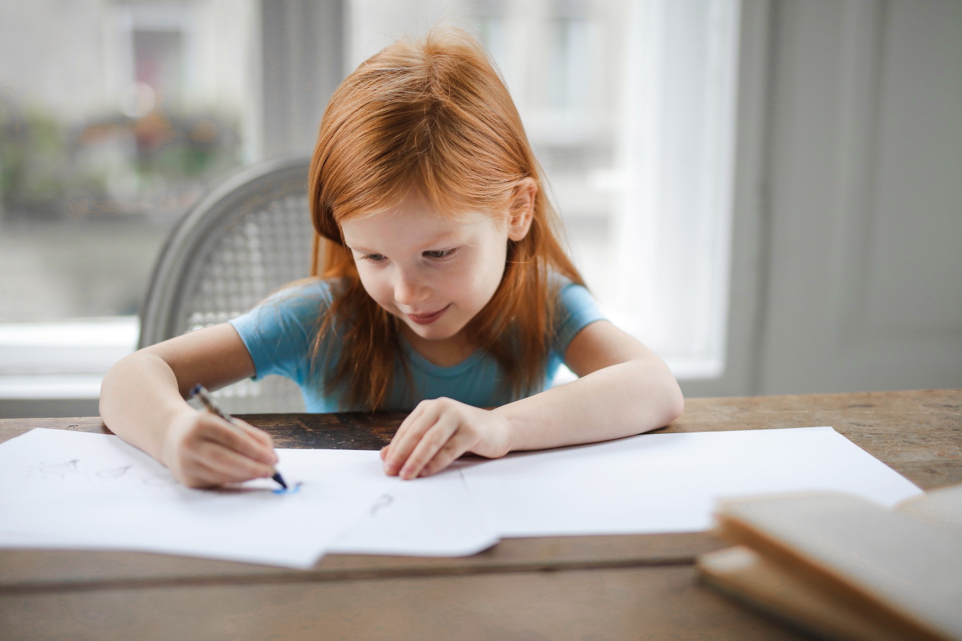 child writing girl