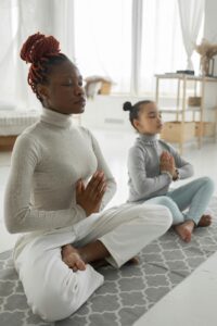 Meditating child and mother