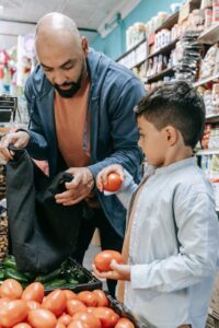 father son groceries tomatoes