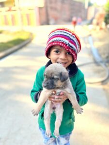 boy holding a dog