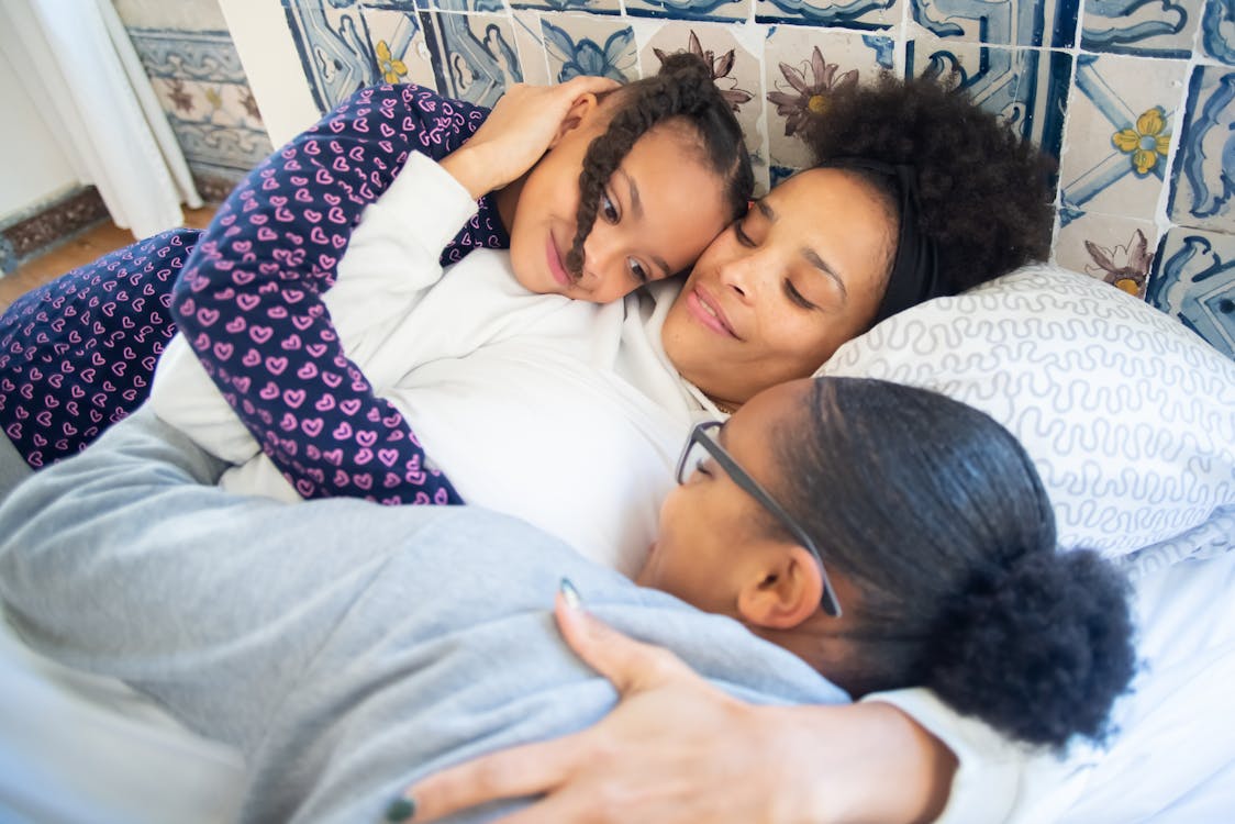 mother and kids embracing