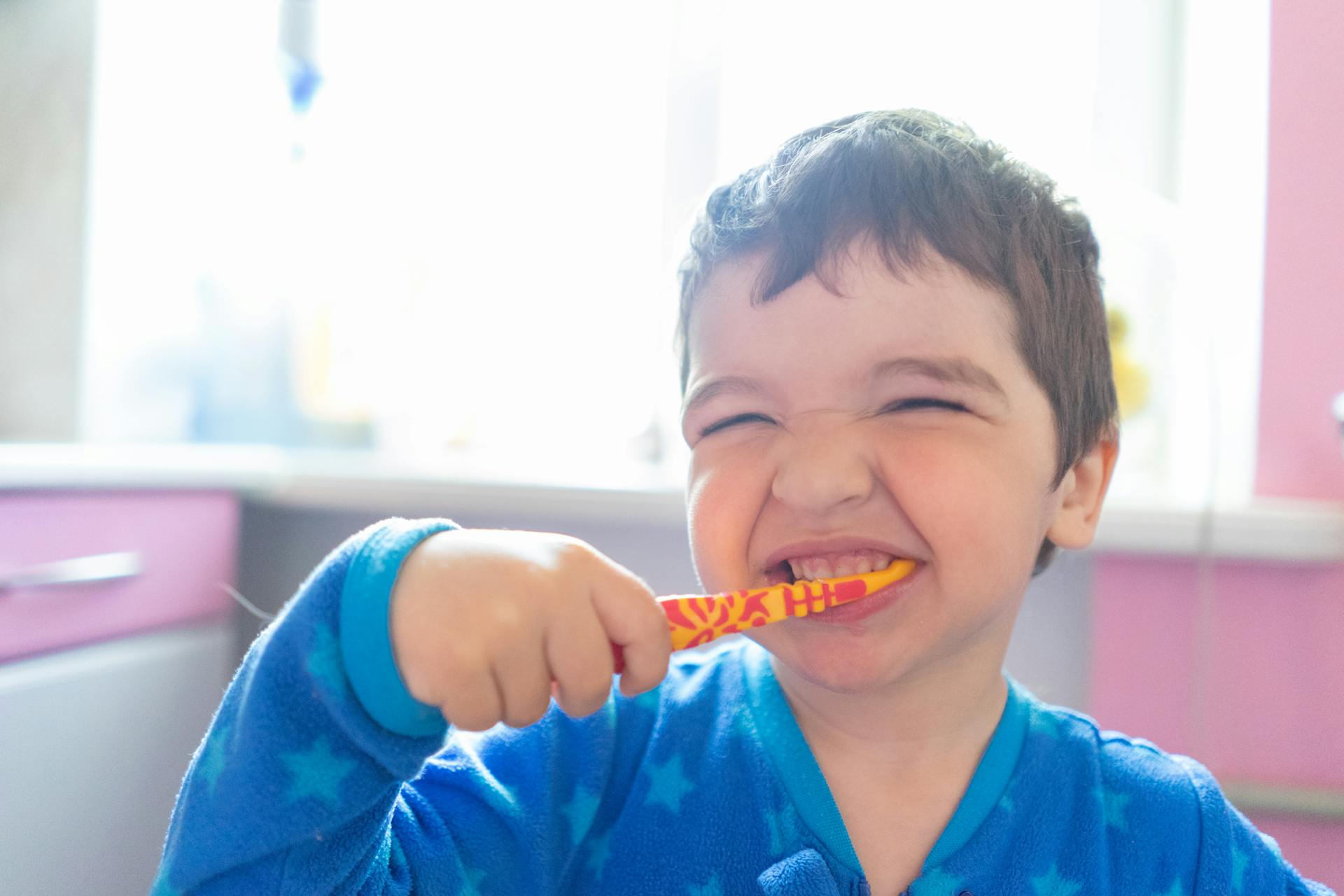 child brushing teeth