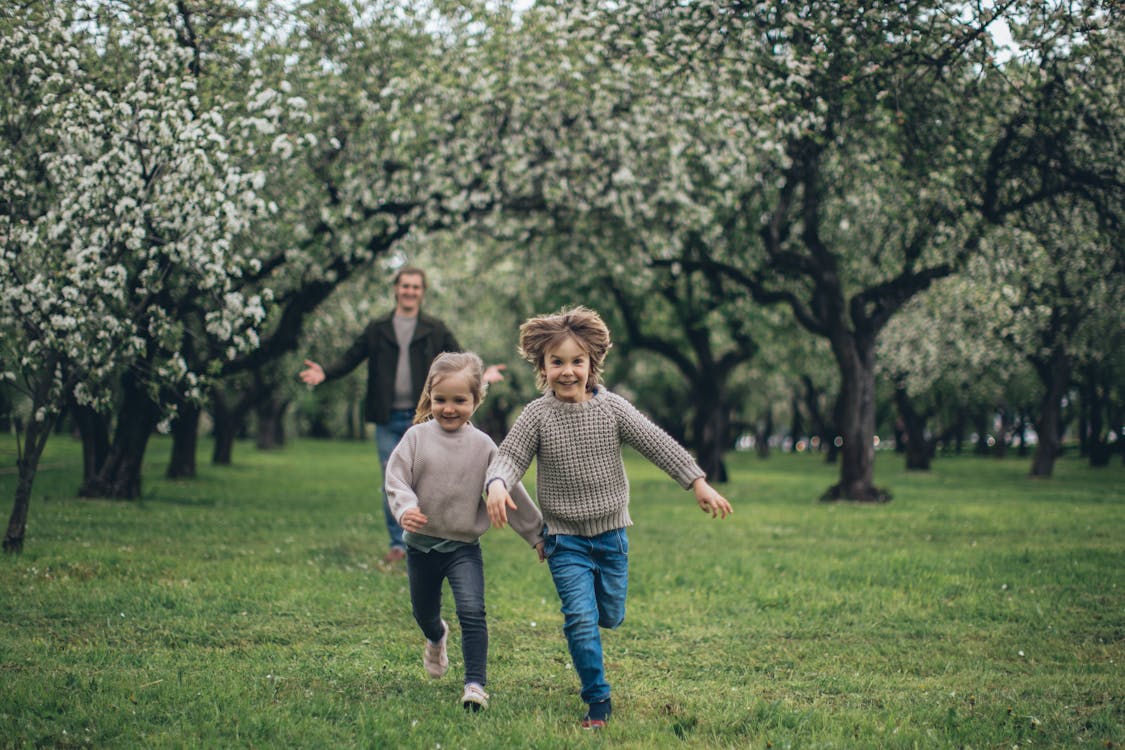 kids running in the grass