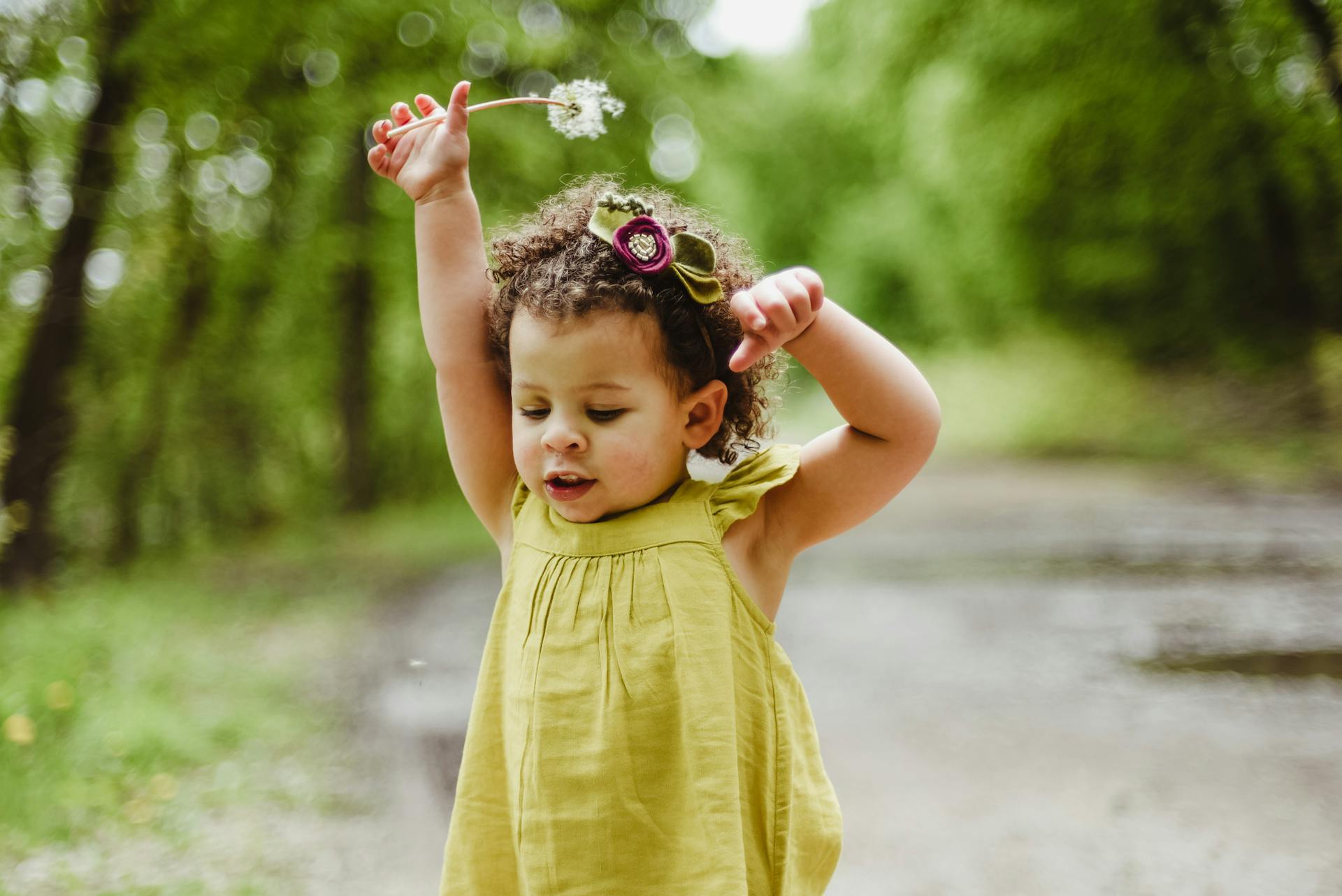 girl in yellow dress with flower